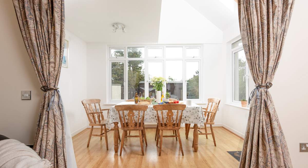 The spacious dining area overlooks the garden.