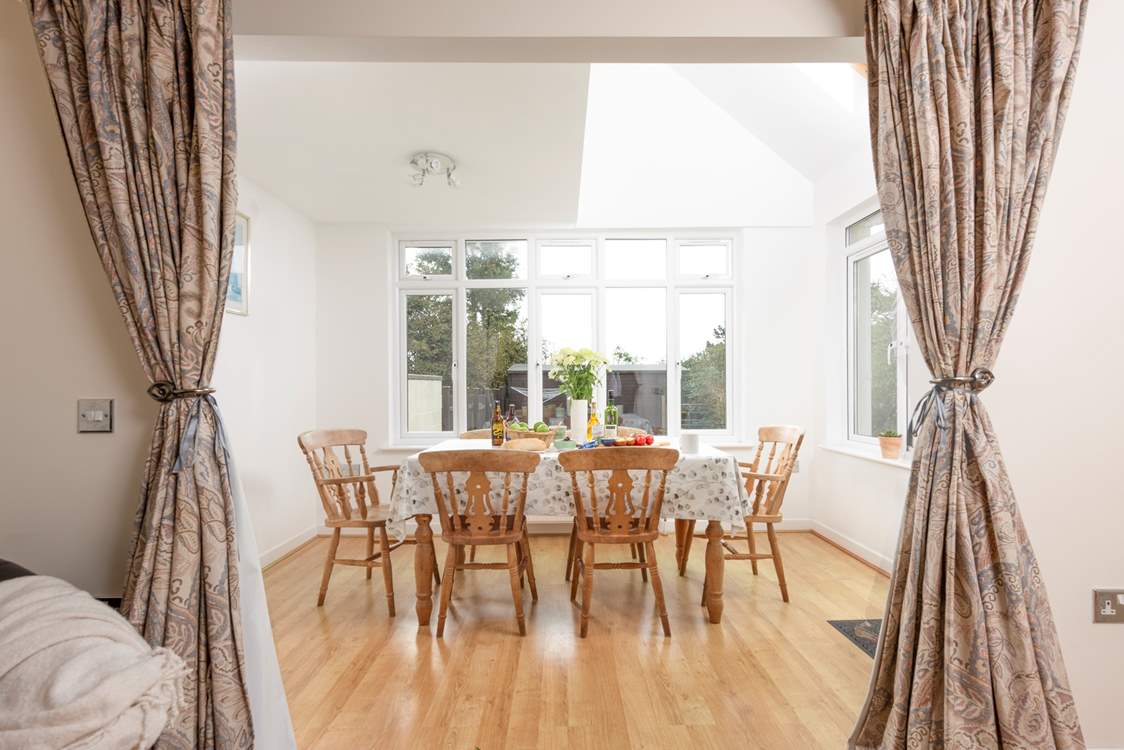The spacious dining area overlooks the garden.