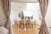 The spacious dining area overlooks the garden.