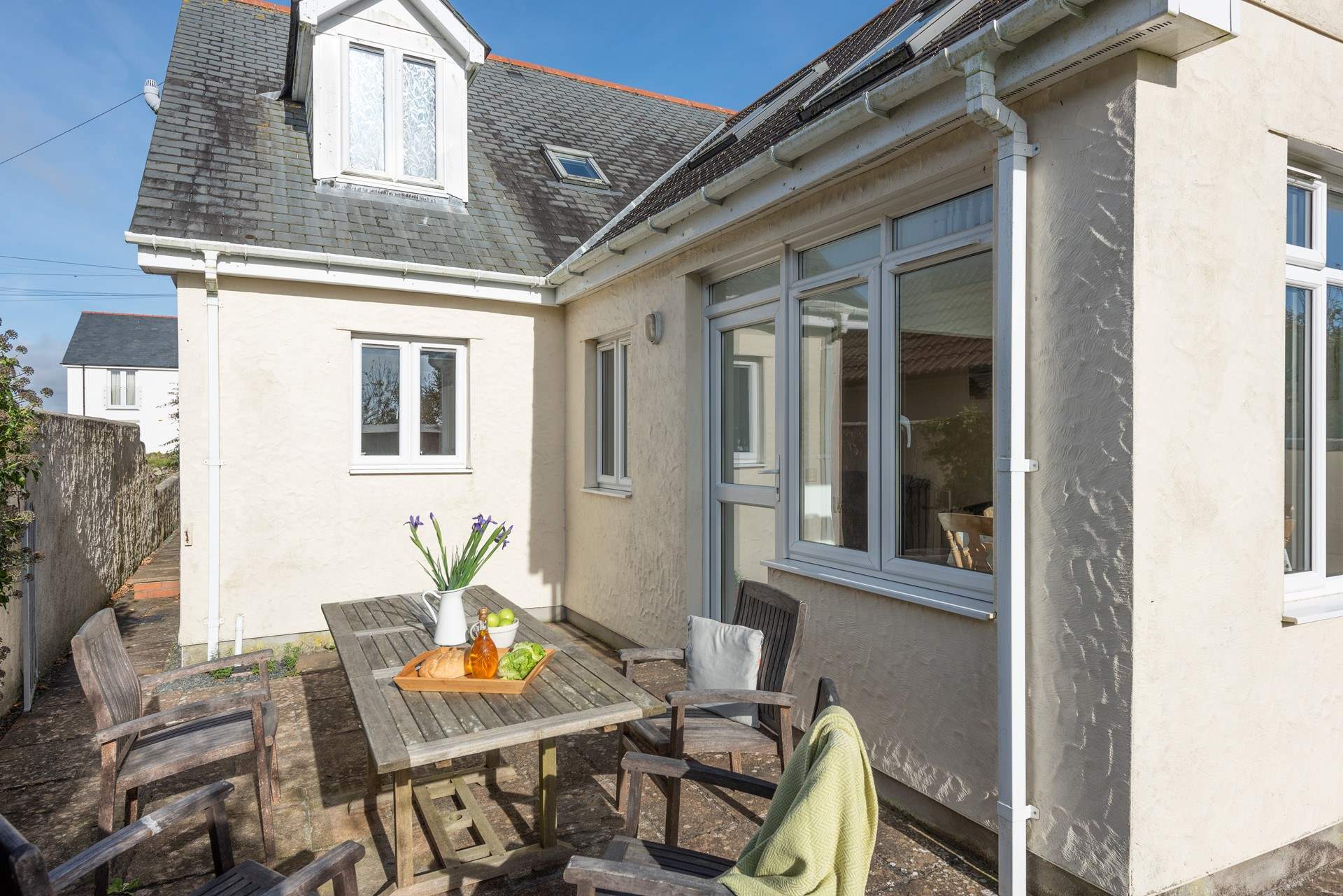 The outdoor seating area is very private and sheltered, accessed through the kitchen and dining-room door.