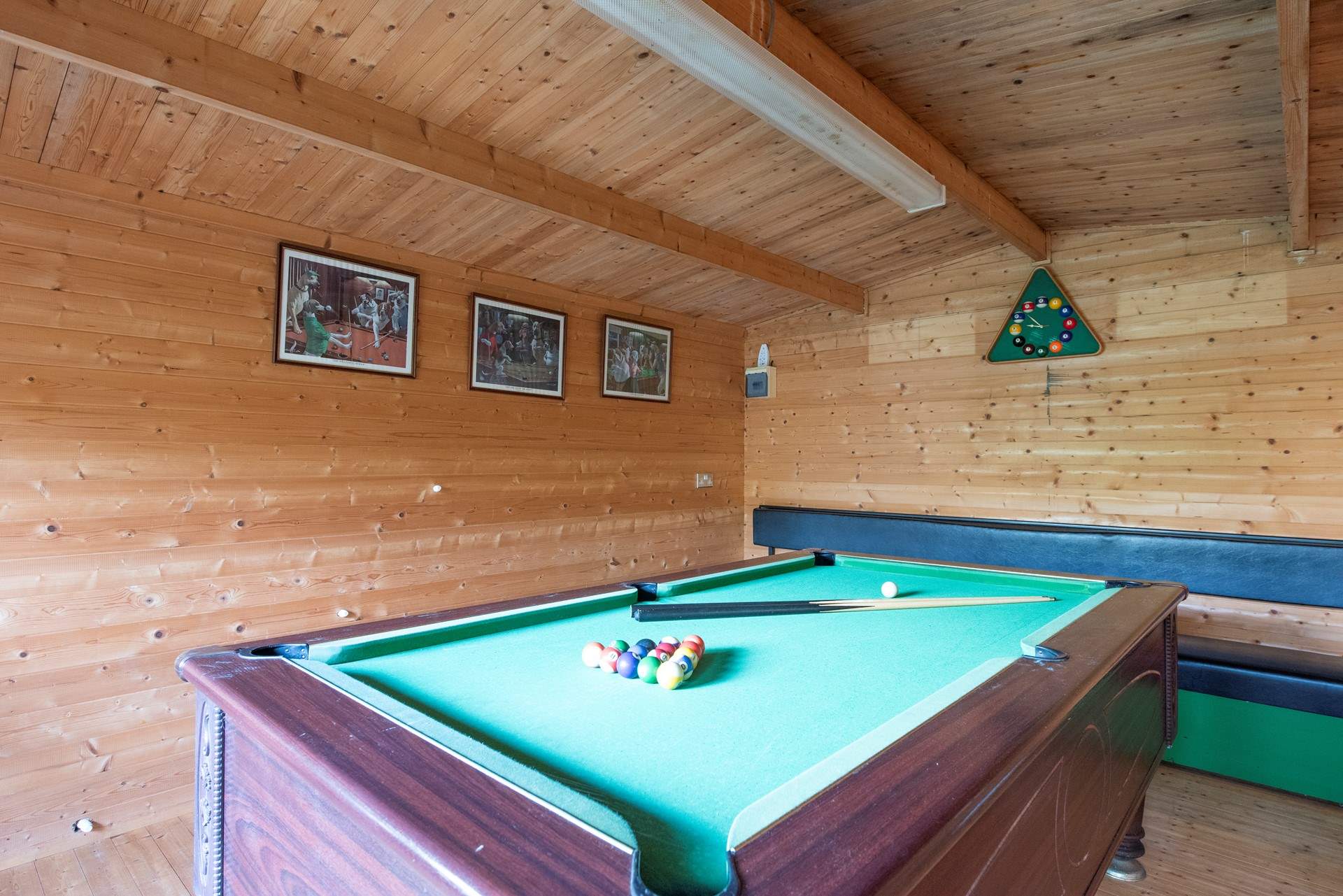 A gate at the end of the enclosed garden leads through to the games-room.