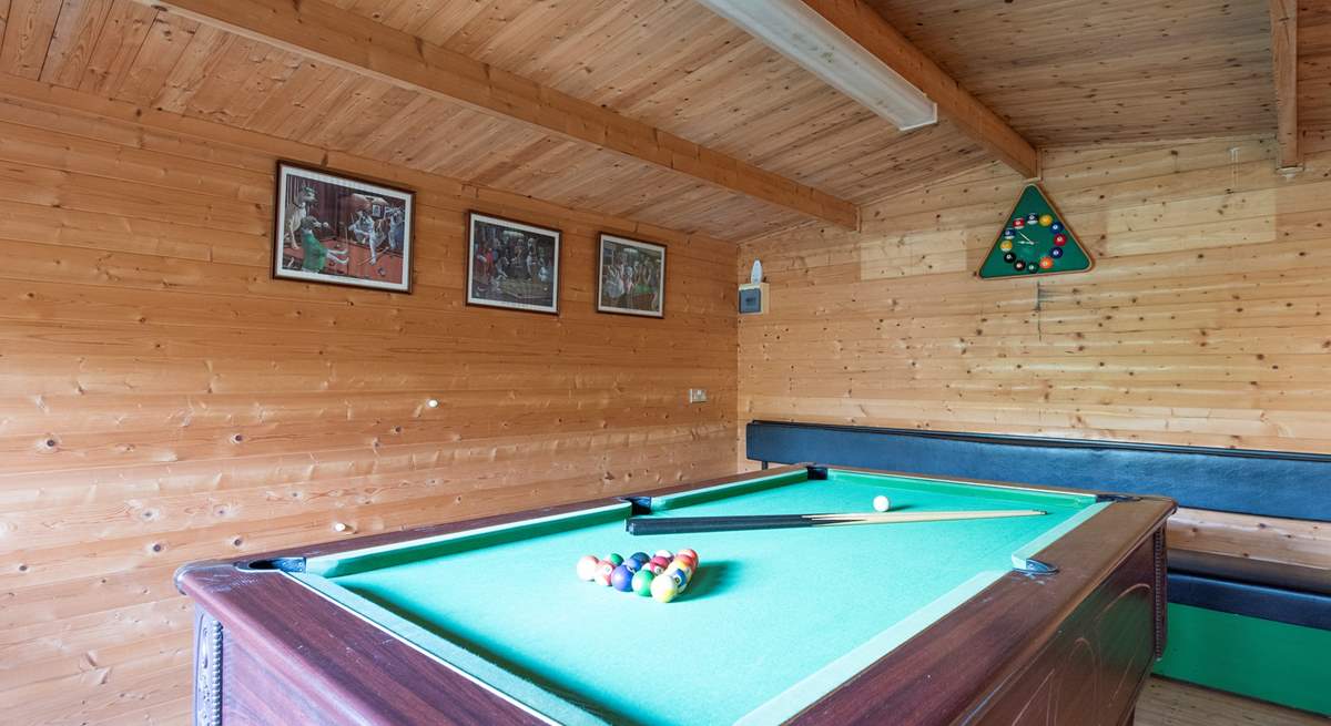 A gate at the end of the enclosed garden leads through to the games-room.