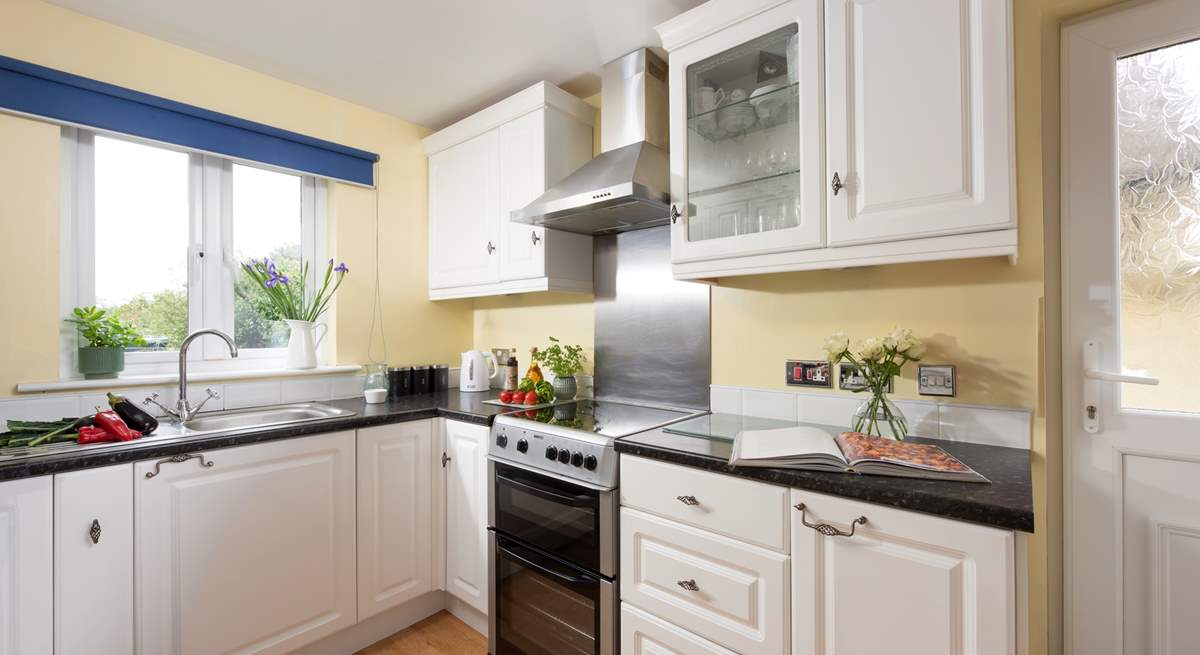 The kitchen overlooks the garden.