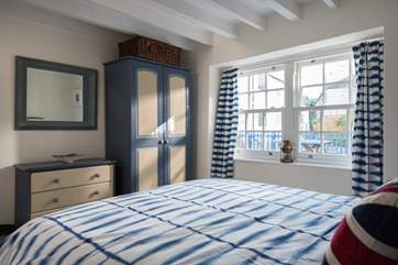 The second bedroom looks out over the courtyard to the front (Bedroom 2).