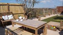 The pretty garden is fully enclosed with views to enjoy. 