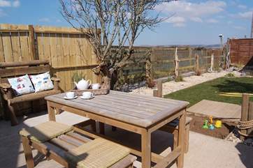 The pretty garden is fully enclosed and there is even a sandpit for children to enjoy.