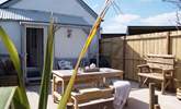 Looking back towards the cottage from the sheltered garden with open views to one side. There is an area of lawn as well. - Thumbnail Image