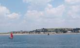 Sea Cottage is tucked away in the sand dunes to the left of this photograph of Instow. - Thumbnail Image