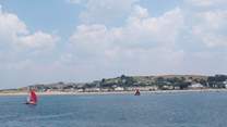 Sea Cottage is tucked away in the sand dunes to the left of this photograph of Instow.