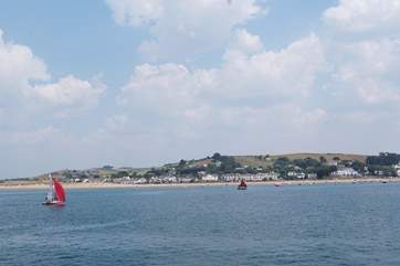 Sea Cottage is tucked away in the sand dunes to the left of this photograph of Instow.