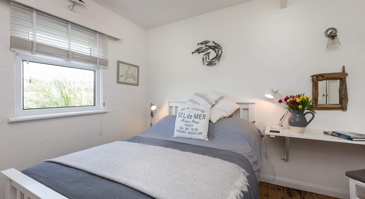 The main bedroom with its comfortable bed and pretty furnishings. This room looks out over the Tarka Trail.