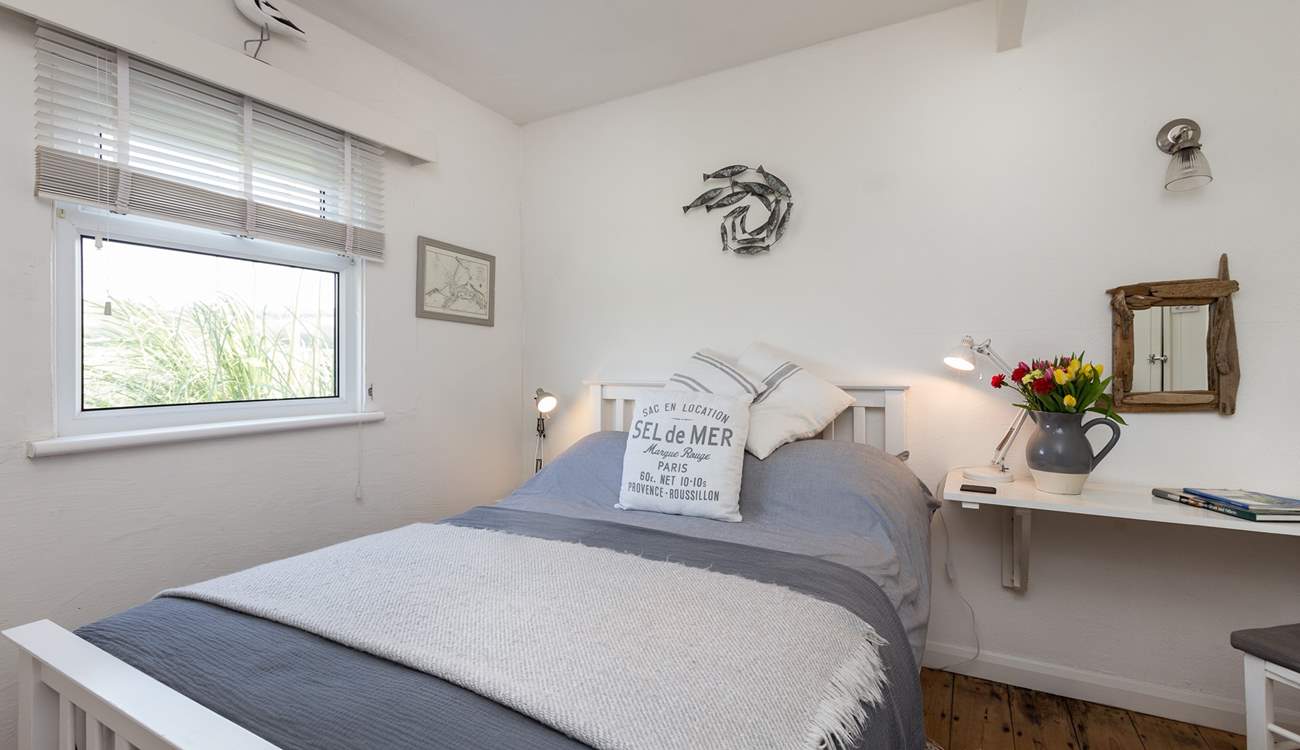 The main bedroom with its comfortable bed and pretty furnishings. This room looks out over the Tarka Trail.