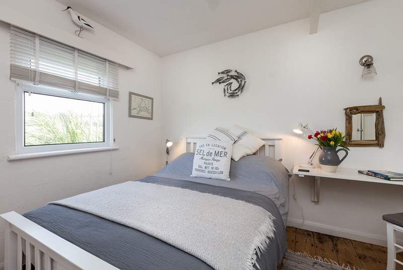 The main bedroom with its comfortable bed and pretty furnishings. This room looks out over the Tarka Trail.