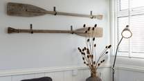 Vintage oars make charming wall art.