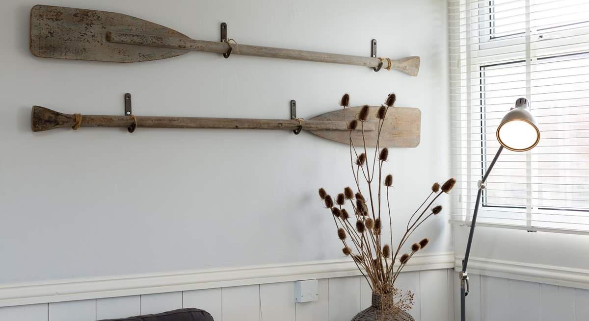 Vintage oars make charming wall art.