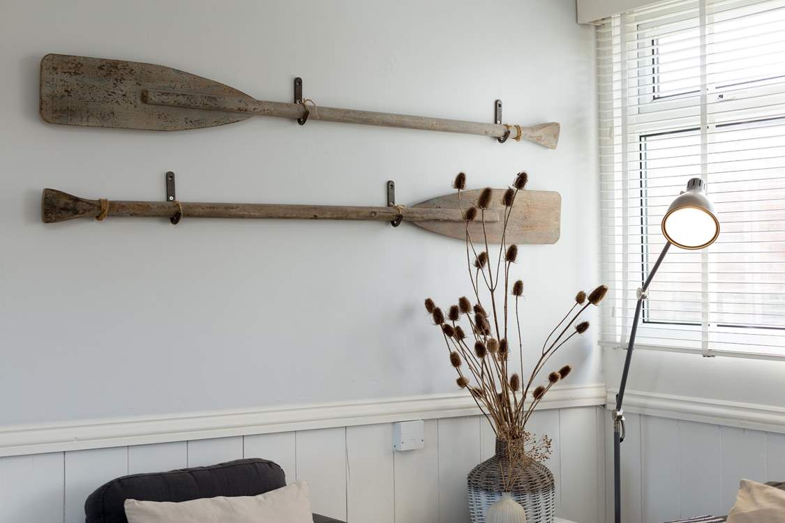 Vintage oars make charming wall art.