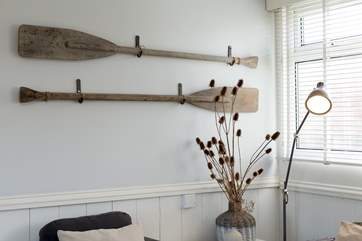 Vintage oars make charming wall art.