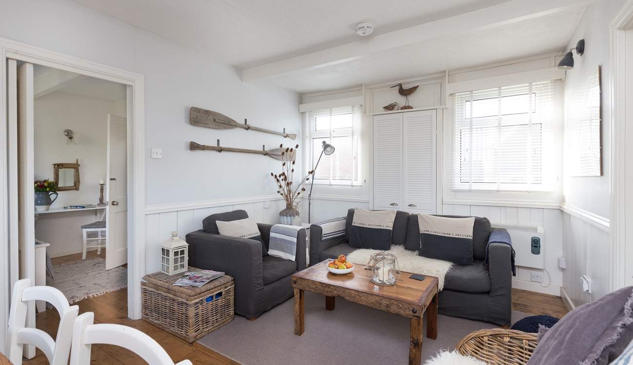 There is plenty of comfortable seating for all in this bright and tasteful room.