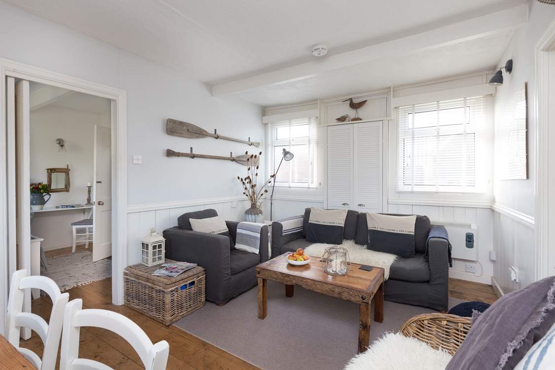 There is plenty of comfortable seating for all in this bright and tasteful room.
