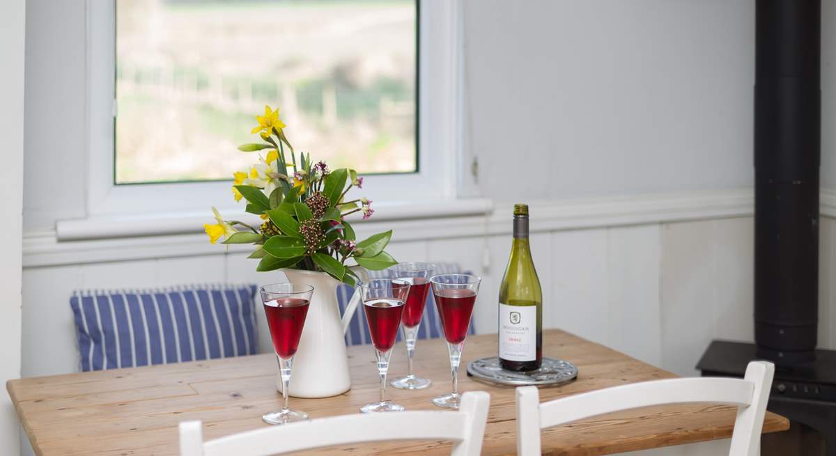 There is a pretty little farmhouse table.