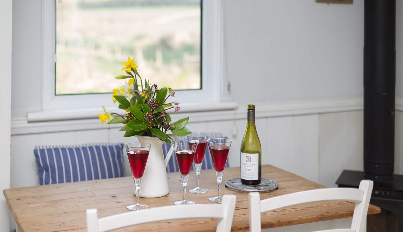 There is a pretty little farmhouse table.