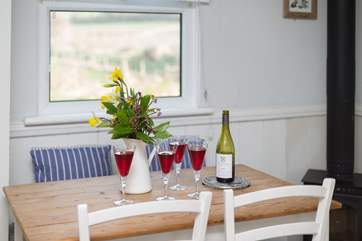 There is a pretty little farmhouse table.