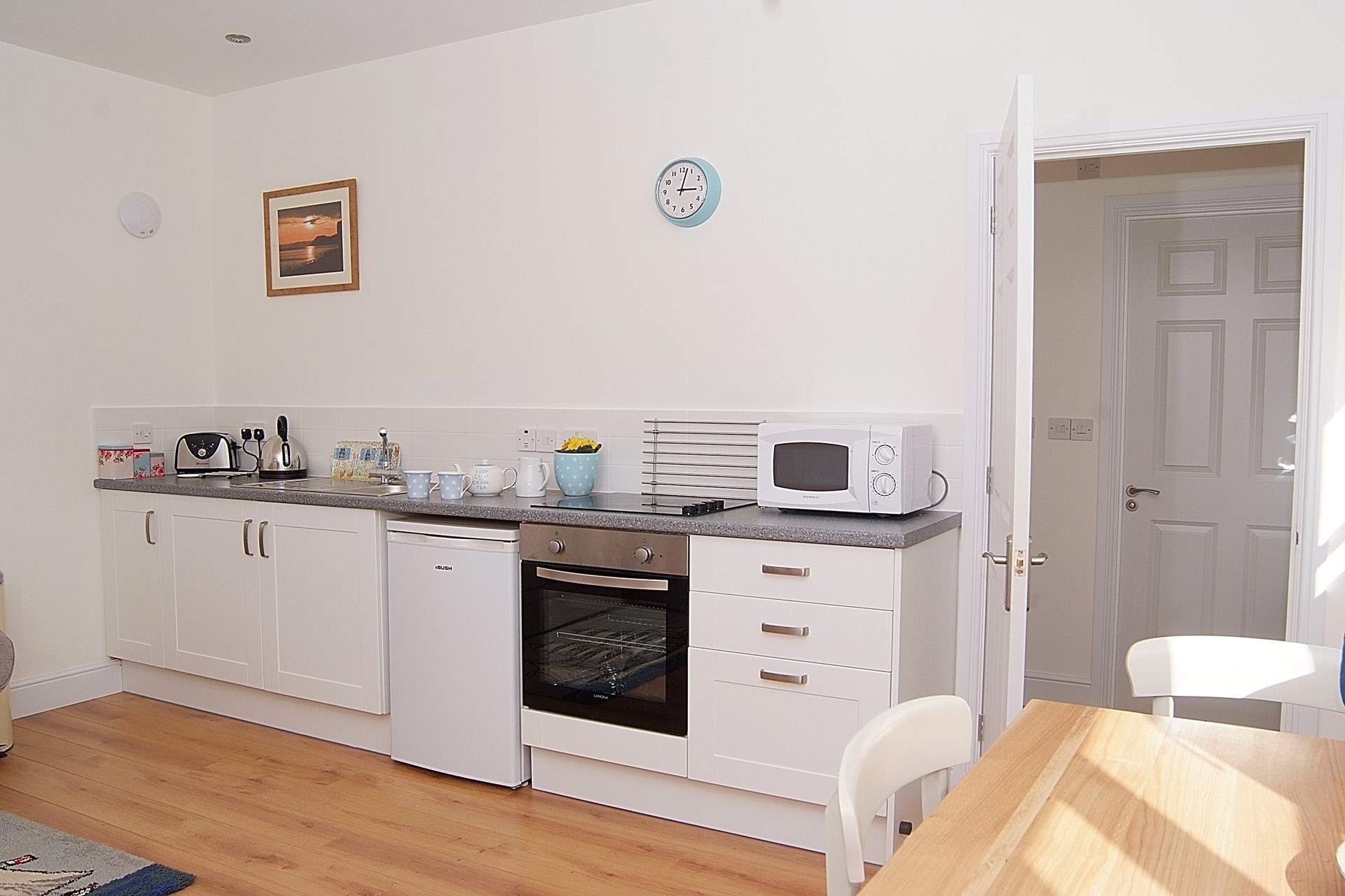 The kitchen-area, cleverly fitted along one wall of the open plan living area.
