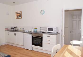 The kitchen-area, cleverly fitted along one wall of the open plan living area.
