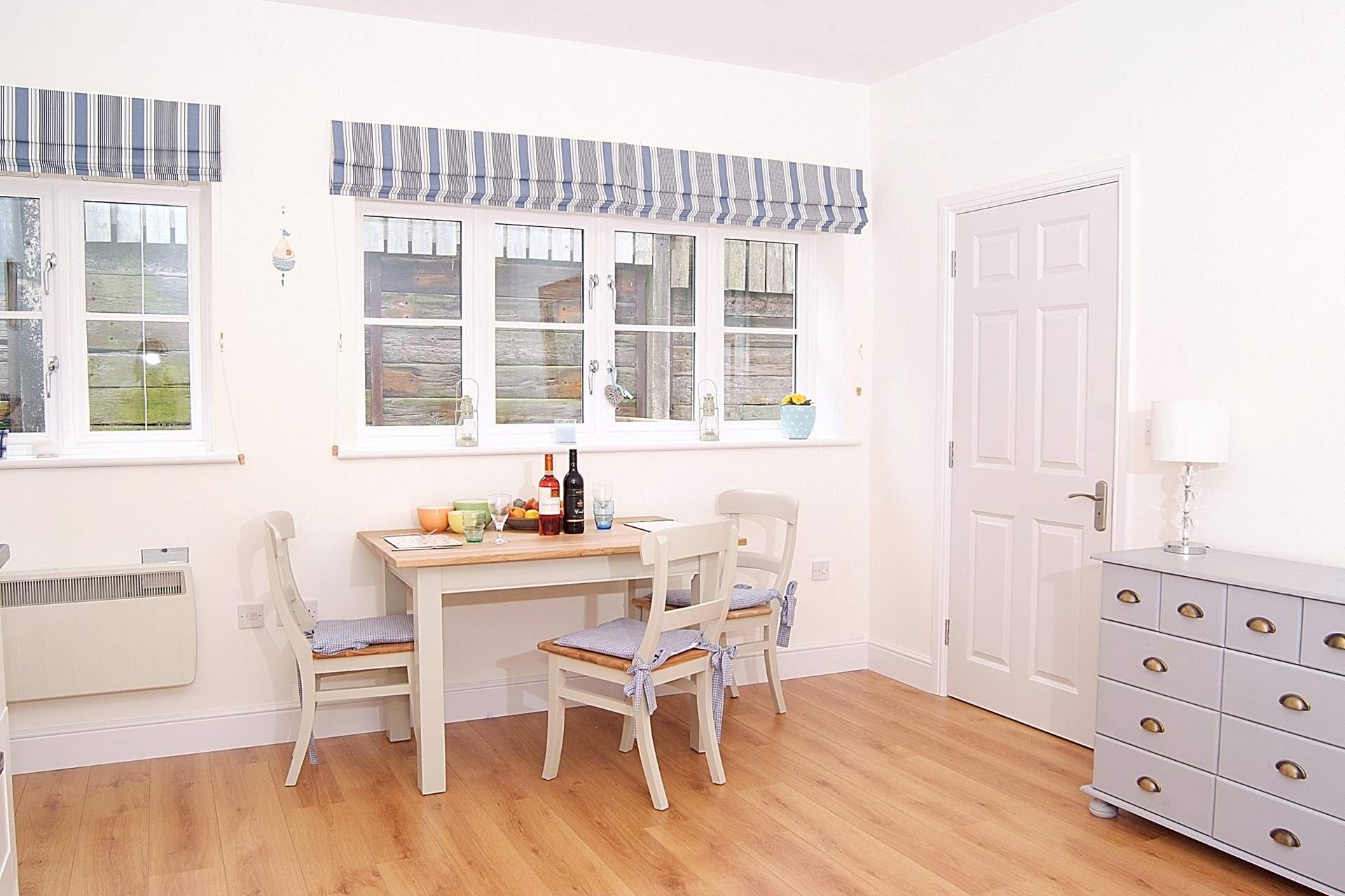 The dining-table sits to one side of the open plan living space, with room for guests to join you for supper.