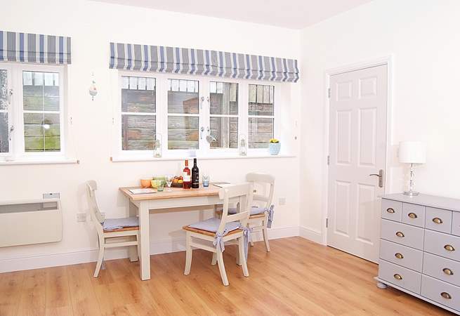 The dining-table sits to one side of the open plan living space, with room for guests to join you for supper.