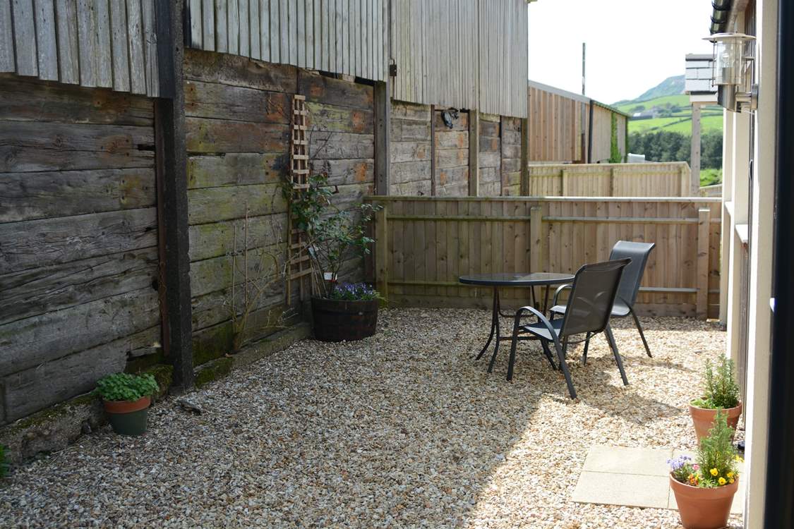 The Linhay is tucked at the back of this small development of three cottages, next to the remaining farm buildings, with an enclosed and sheltered private patio-area.
