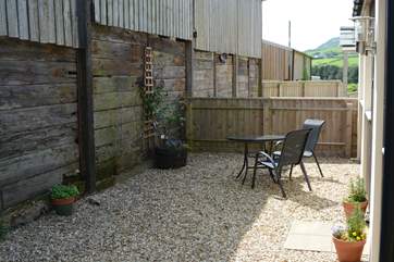 The Linhay is tucked at the back of this small development of three cottages, next to the remaining farm buildings, with an enclosed and sheltered private patio-area.