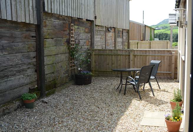 The Linhay is tucked at the back of this small development of three cottages, next to the remaining farm buildings, with an enclosed and sheltered private patio-area.