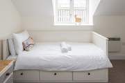 The third bed in bedroom 2 is a 'day bed', but just as comfortable as the twin beds.