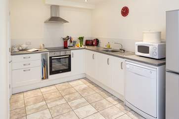 The kitchen is very well-equipped with a large pantry in the corner.