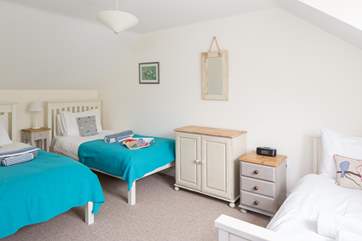 The second bedroom (Bedroom 2) has plenty of space for three beds.