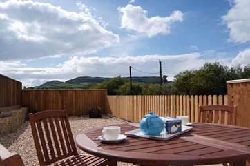 Enjoy eating outside on this fabulous patio with views right across to Golden Cap.