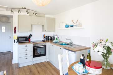 The cleverly designed kitchen is integrated within the living-area.