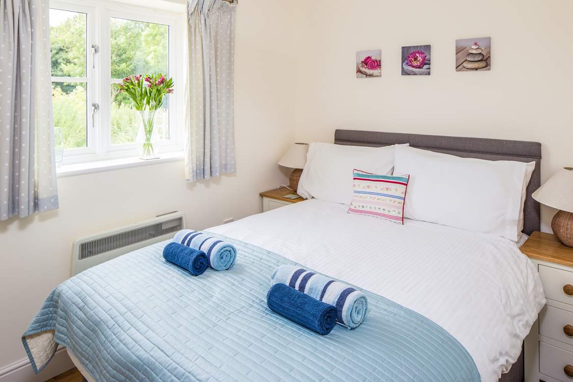 The cosy bedroom has a super comfy double bed.