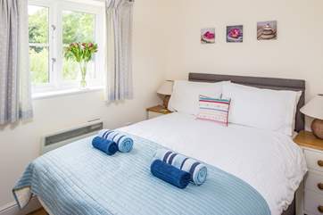 The cosy bedroom has a super comfy double bed.