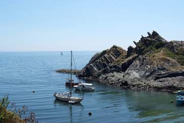 Boats waiting for the tide to rise to go into Polperro harbour.