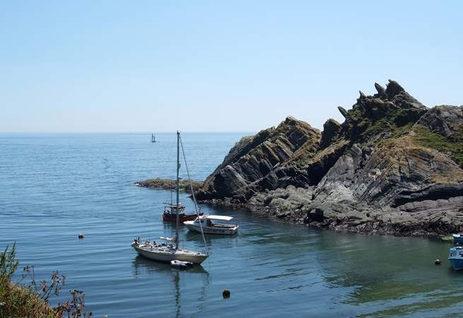Boats waiting for the tide to rise to go into Polperro harbour.