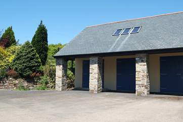 The apartment is set above the owners' triple garage (used as a wood store, not for vehicles).