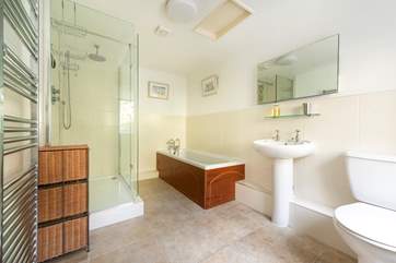 The en suite bathroom with a bath and a huge shower cubicle.