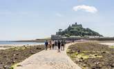 Walk along the causeway to St Michael's Mount at low tide and catch the ferry boat back when the tide is high. - Thumbnail Image