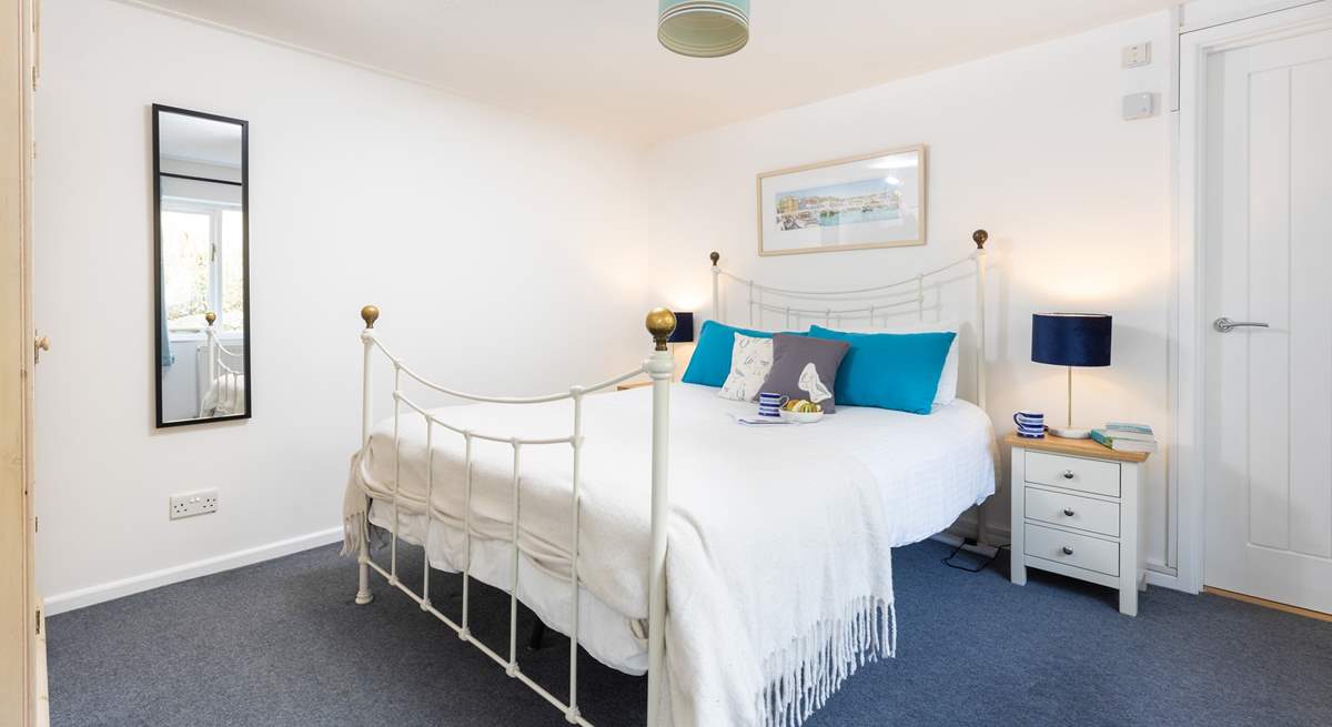 The gorgeous double bedroom has a feature bedstead. 