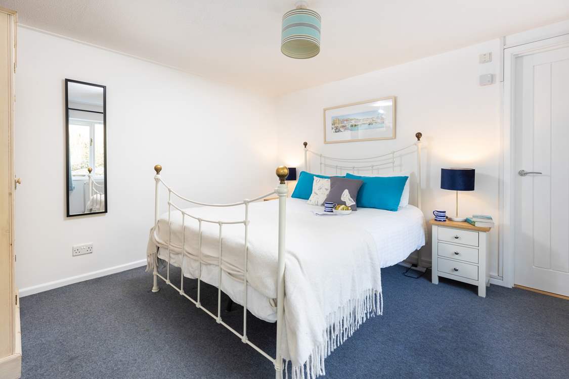 The gorgeous double bedroom has a feature bedstead.