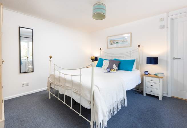 The gorgeous double bedroom has a feature bedstead. 