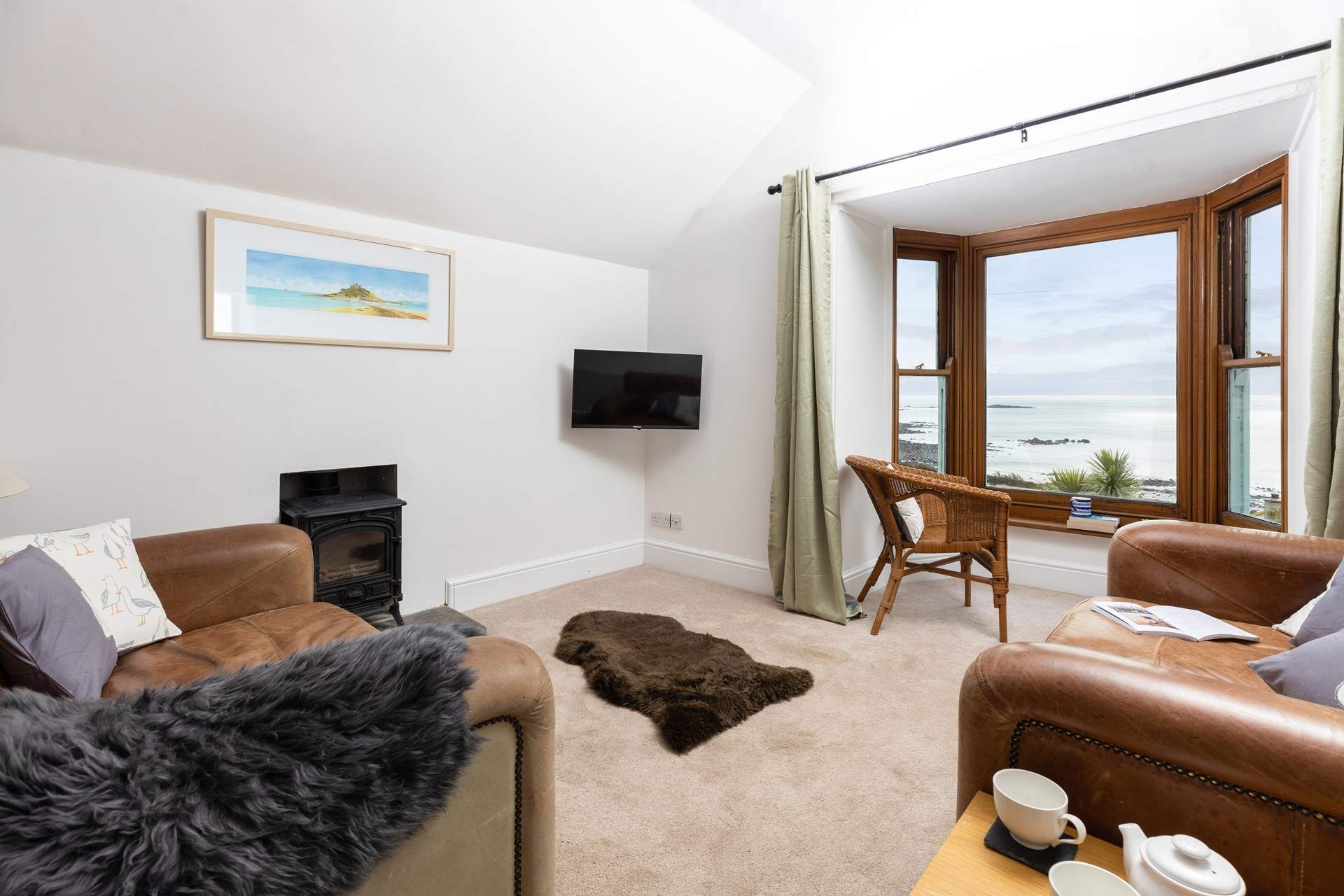The living area is on the first floor to make the most of the captivating views. (The wood-burner is ornamental only).