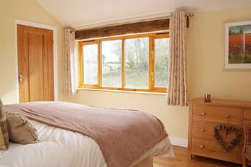 The second bedroom is light and spacious and has a built-in wardrobe.